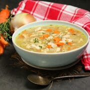 Homemade Turkey Rice Soup in a pale blue bowl.