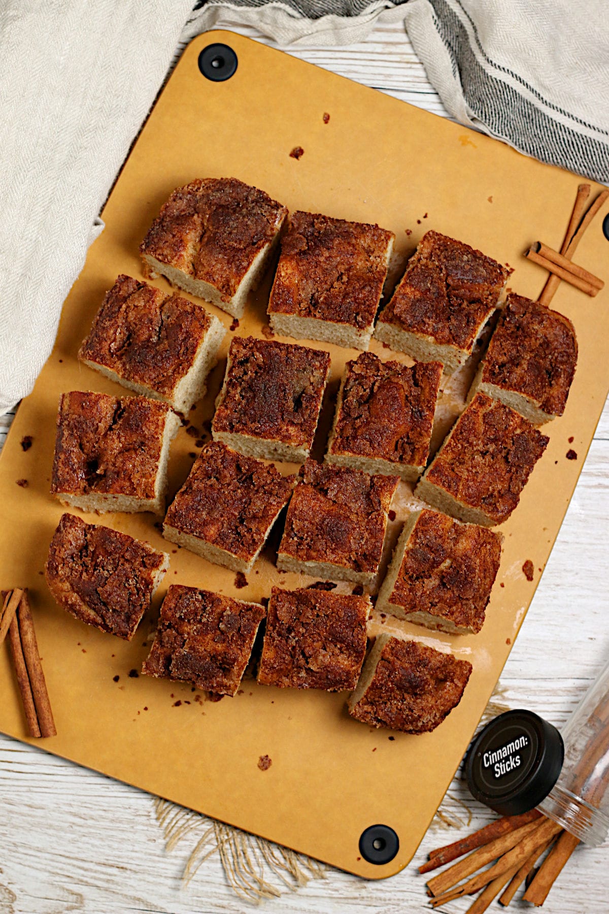 Cinnamon Toast Focaccia An overhead photo of a loaf of Cinnamon Toast Focaccia cut into squares.
