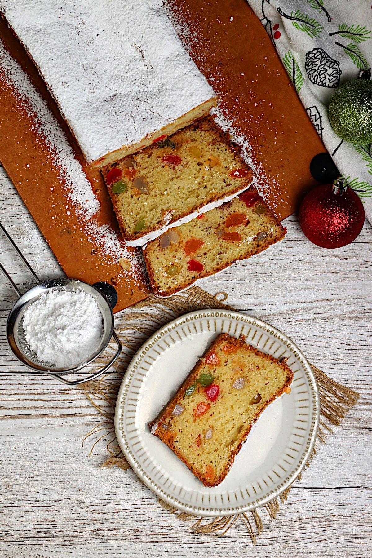 Gumdrop Loaf Cake An overhead photo of a Gumdrop Loaf Cake topped with powdered sugar.