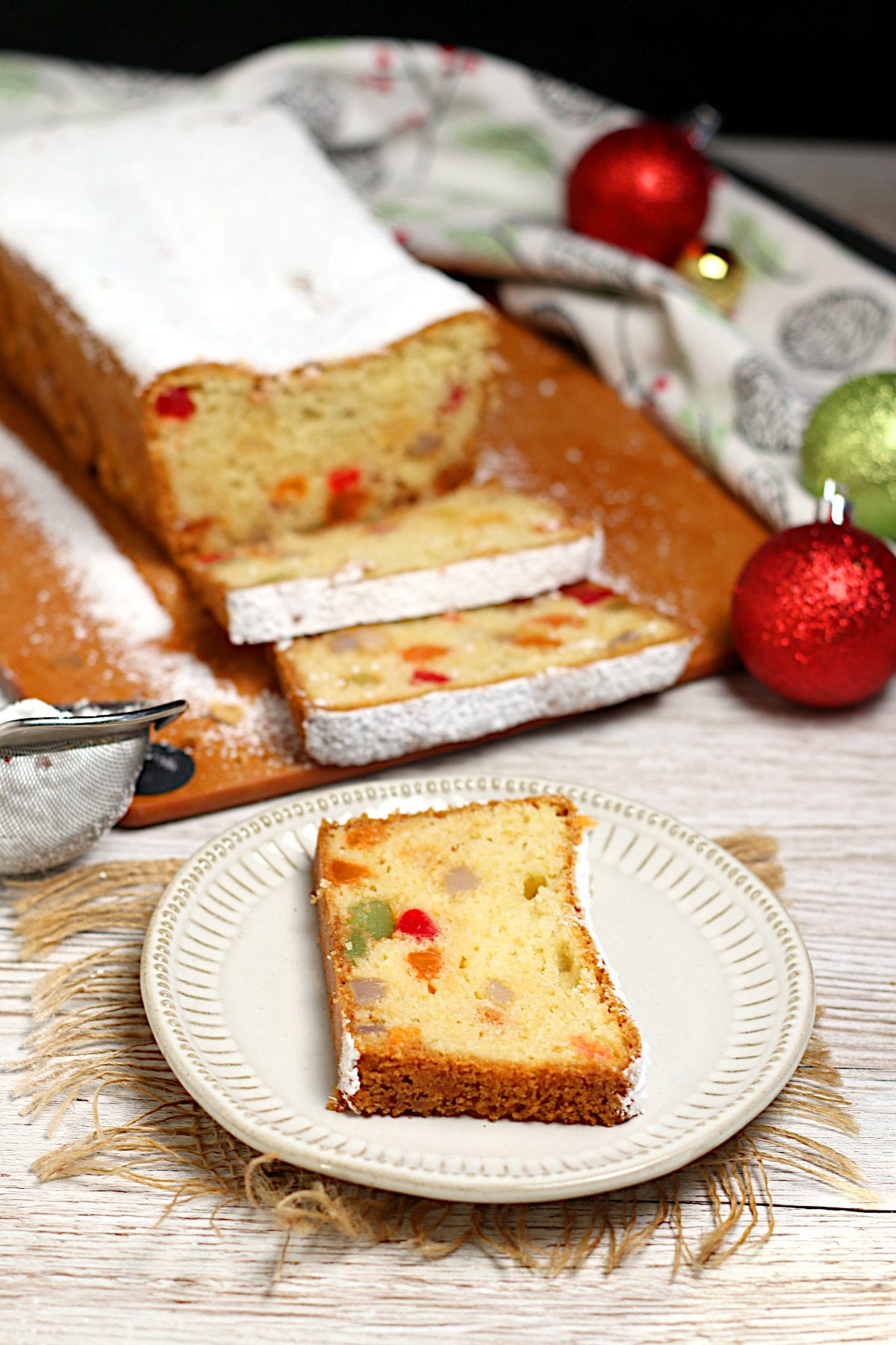 Gumdrop Loaf Cake A slice of Gumdrop Loaf Cake on a small white plate.