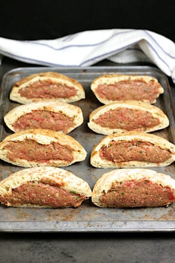 Arayes on a baking pan before cooking.