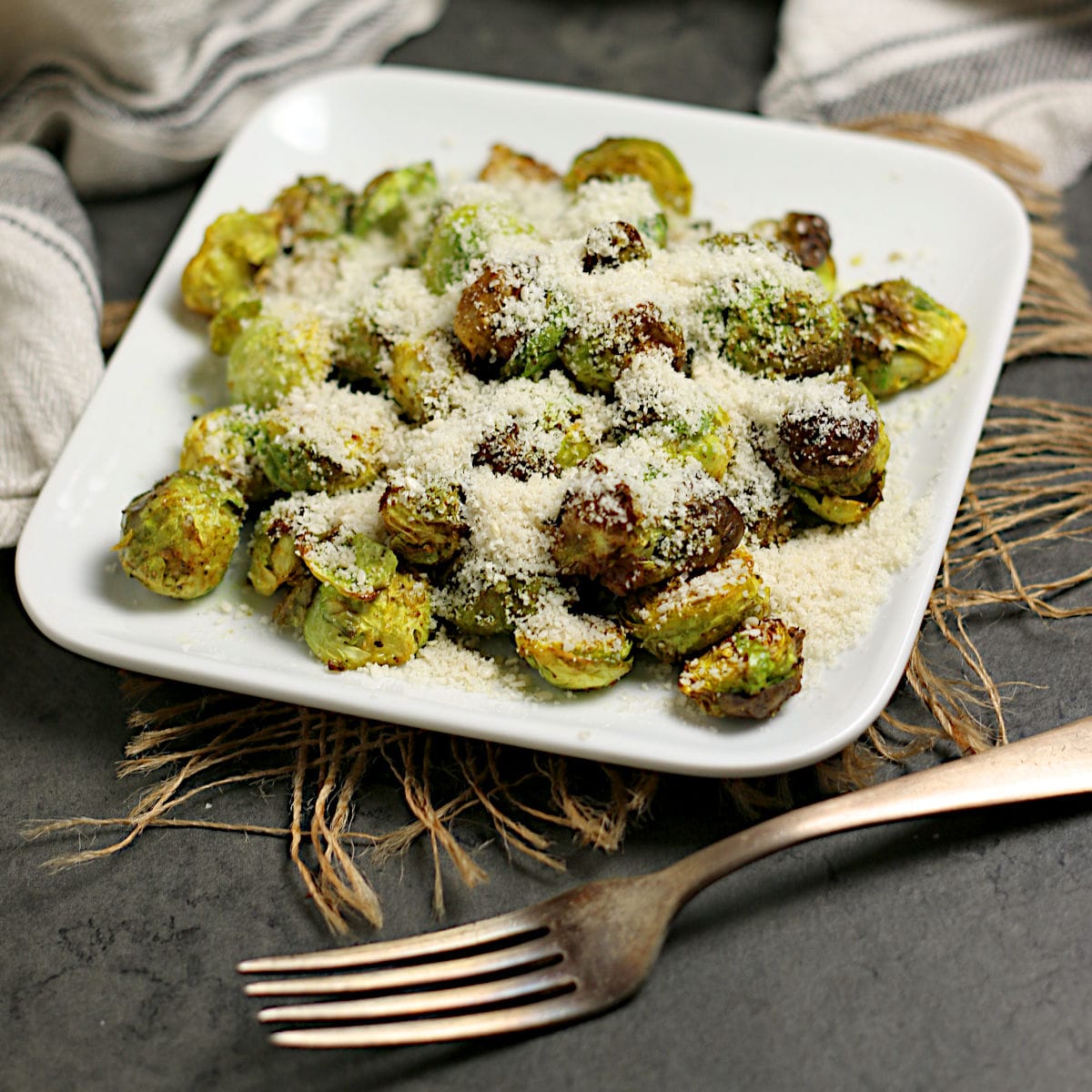 Domestic Dreamboat: Real, Easy, Food. Crispy Brussels Sprouts with Curry and Sesame Powder on a small white plate.
