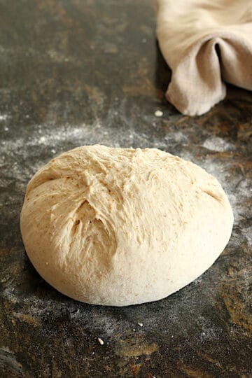 A ball of sourdough ready to go into a banneton.