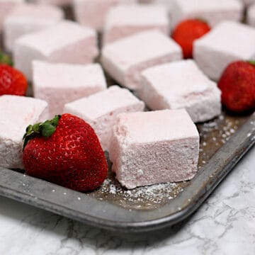 Homemade Strawberry Marshmallows on a baking sheet.