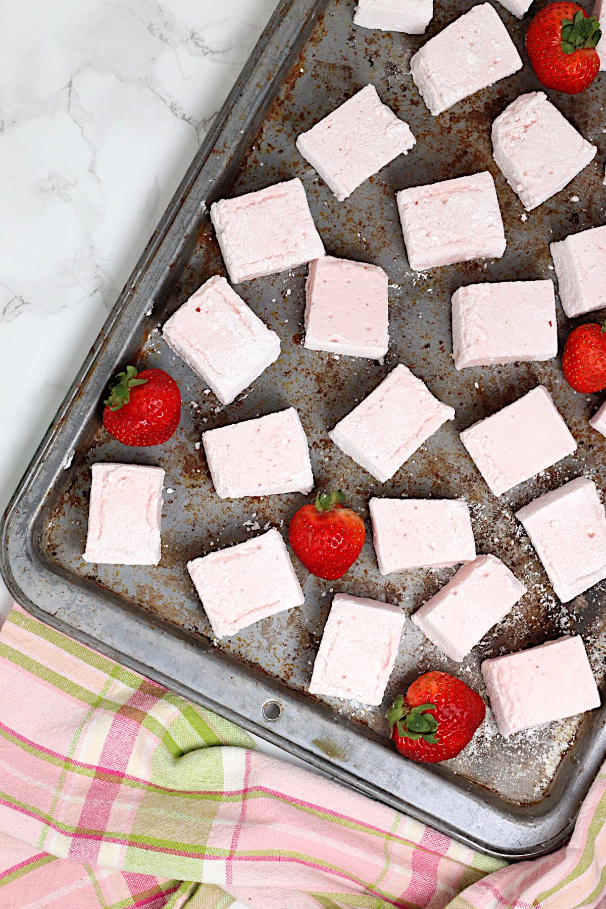 An overhead photo of Homemade Strawberry Marshmallows on a baking sheet.