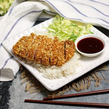 Sliced Air-Fryer Tonkatsu on a bed of white rice.