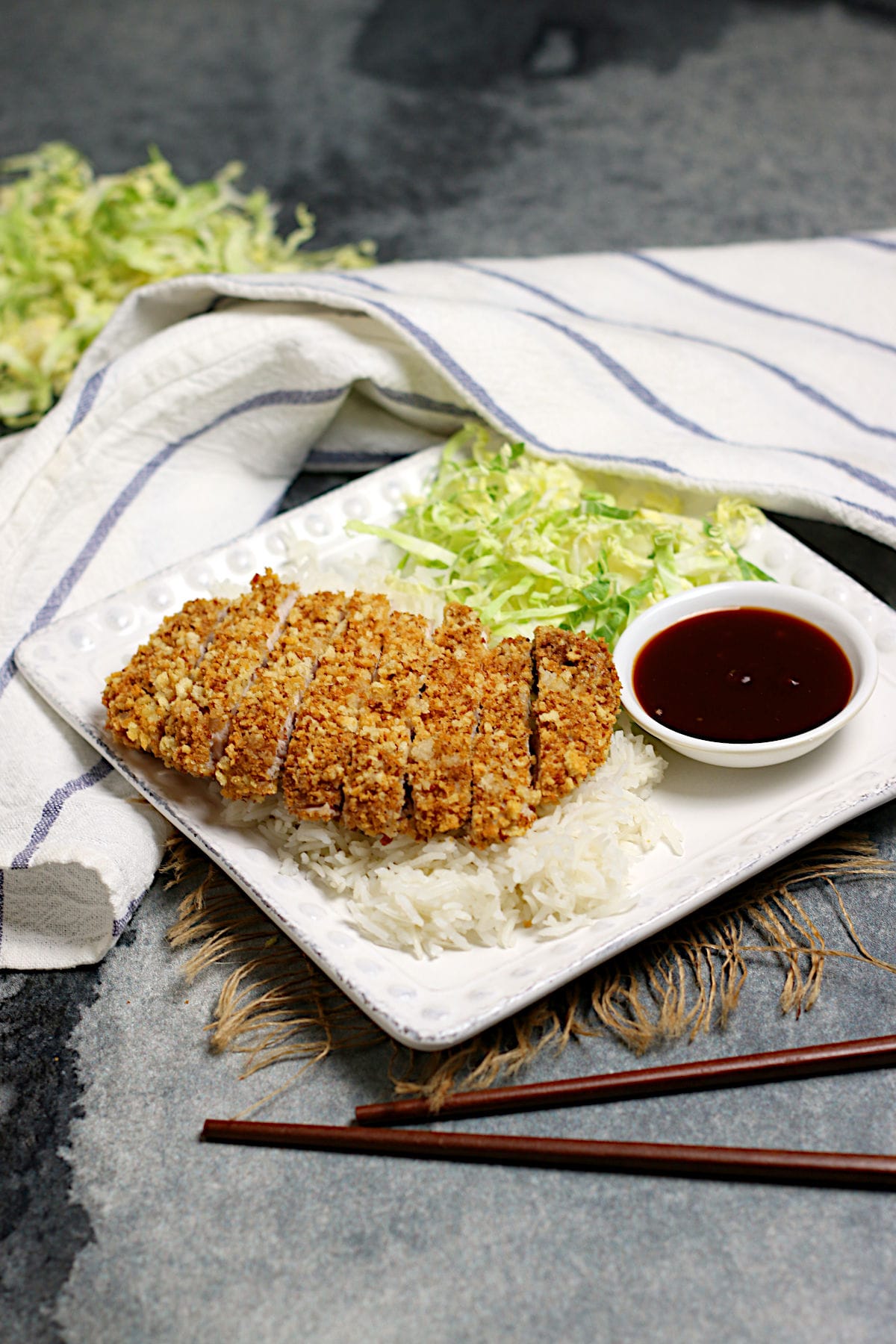 Sliced Air-Fryer Tonkatsu on a bed of white rice.