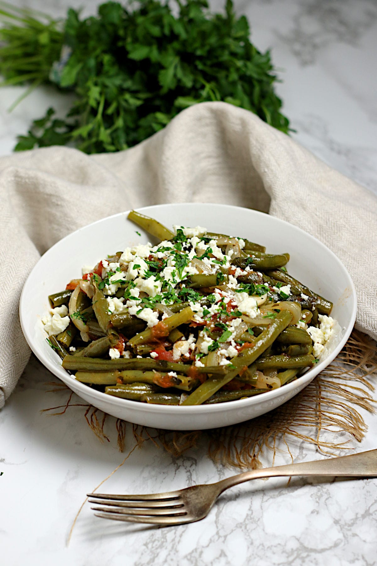 Greek-Style Green Beans in a white bowl.