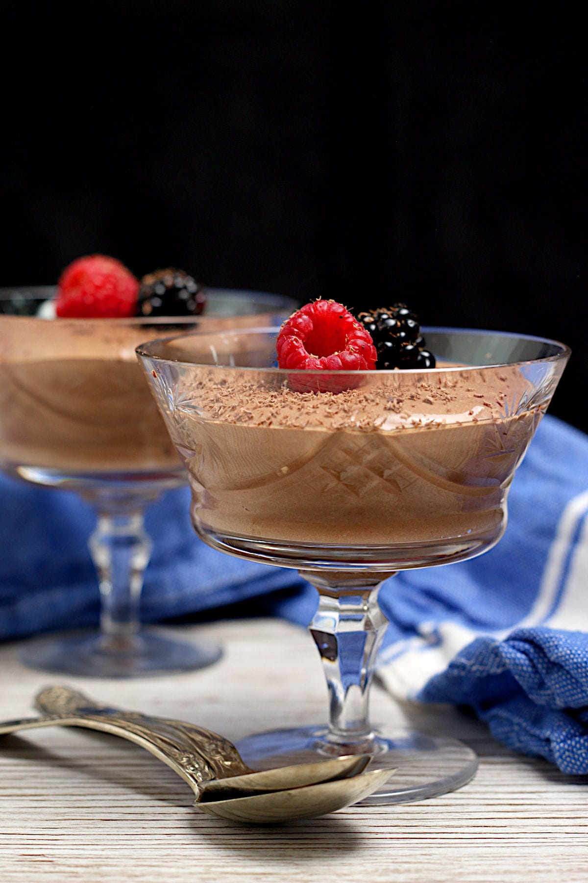 Cottage Cheese Chocolate Mousse A crystal goblet containing Cottage Cheese Chocolate Mousse garnished with berries and shaved chocolate.