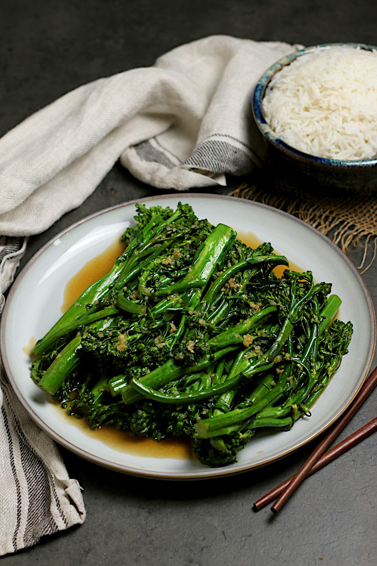 Steamed Broccolini with Garlic Sauce on a large white plate.