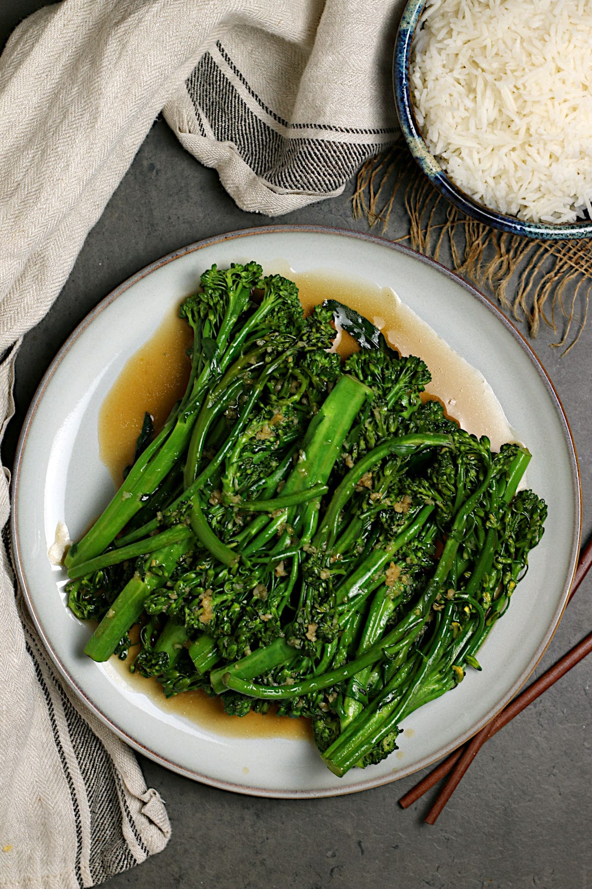 An overhead photo of Steamed Broccolini with Garlic Sauce on a large white plate.