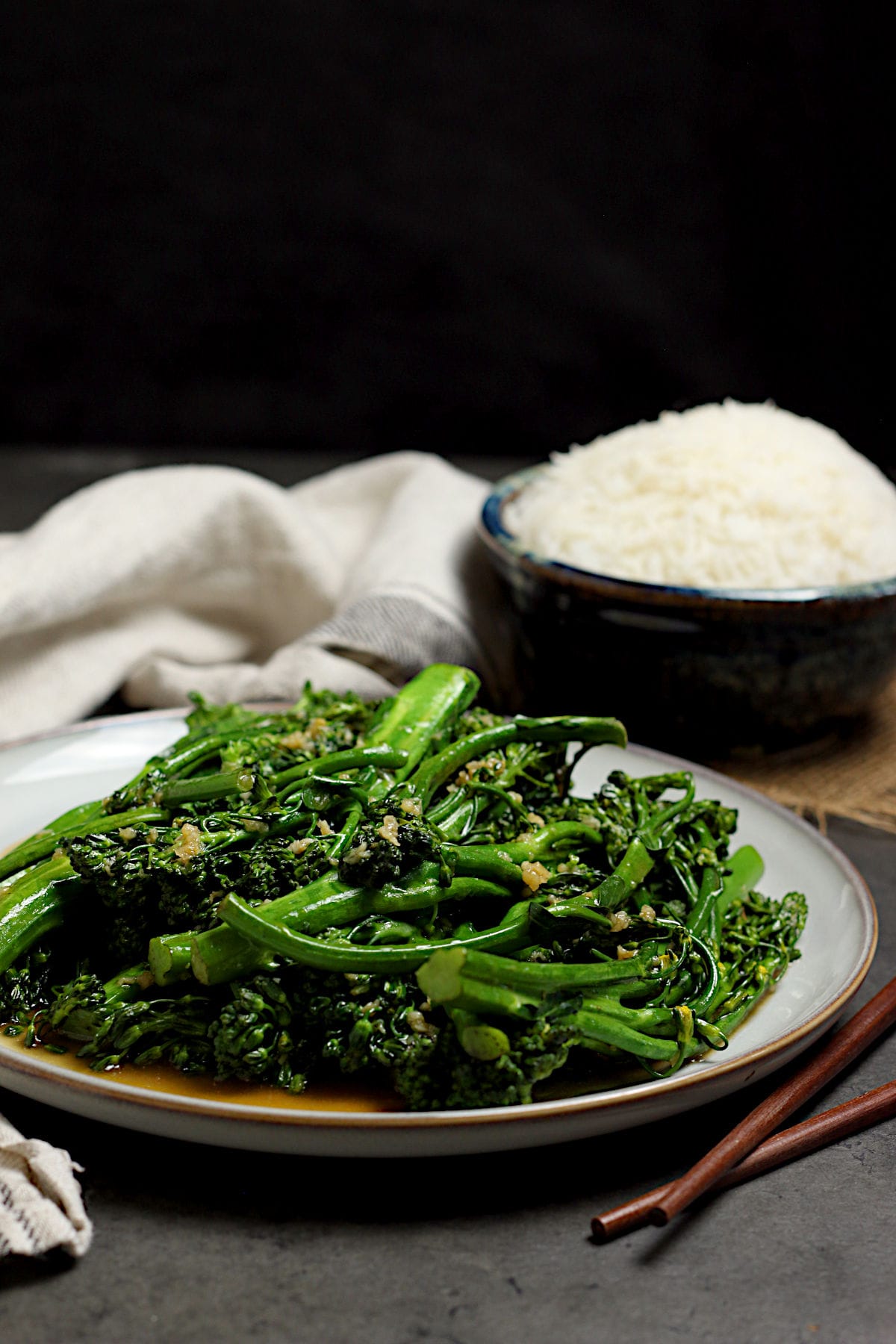 Steamed Broccolini with Garlic Sauce on a large white plate.