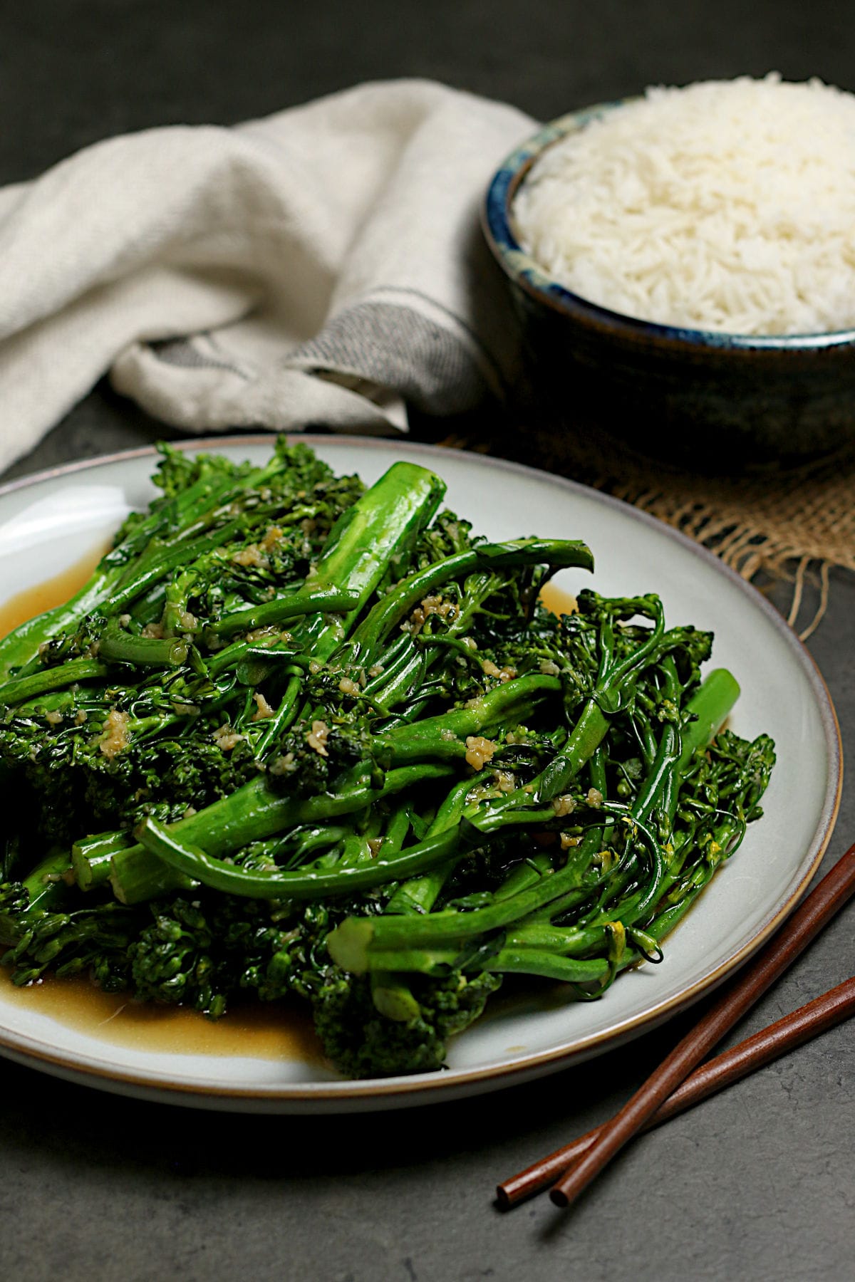 Steamed Broccolini with Garlic Sauce on a large white plate.