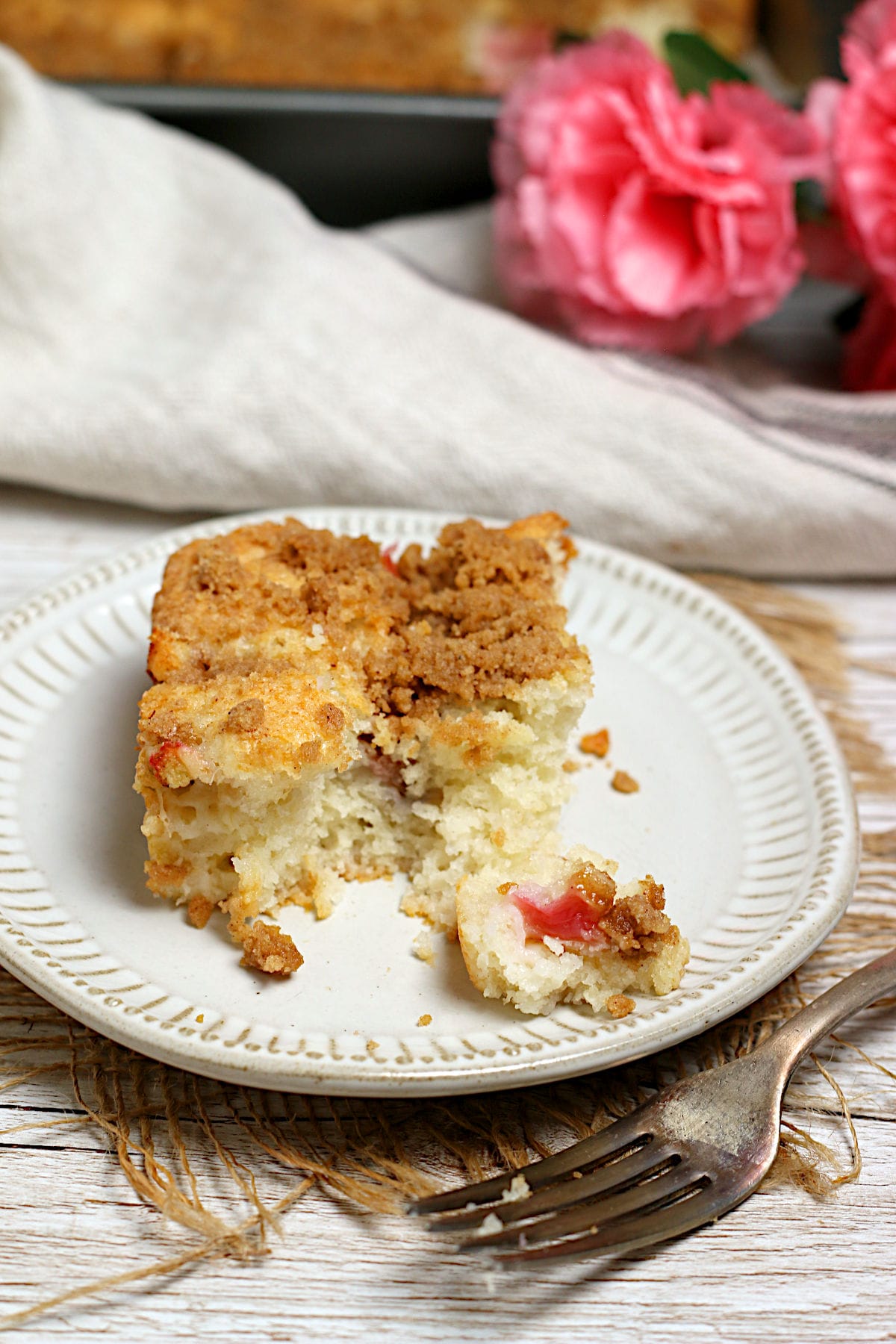 Greek Yogurt Rhubarb Coffee Cake on a small white plate.
