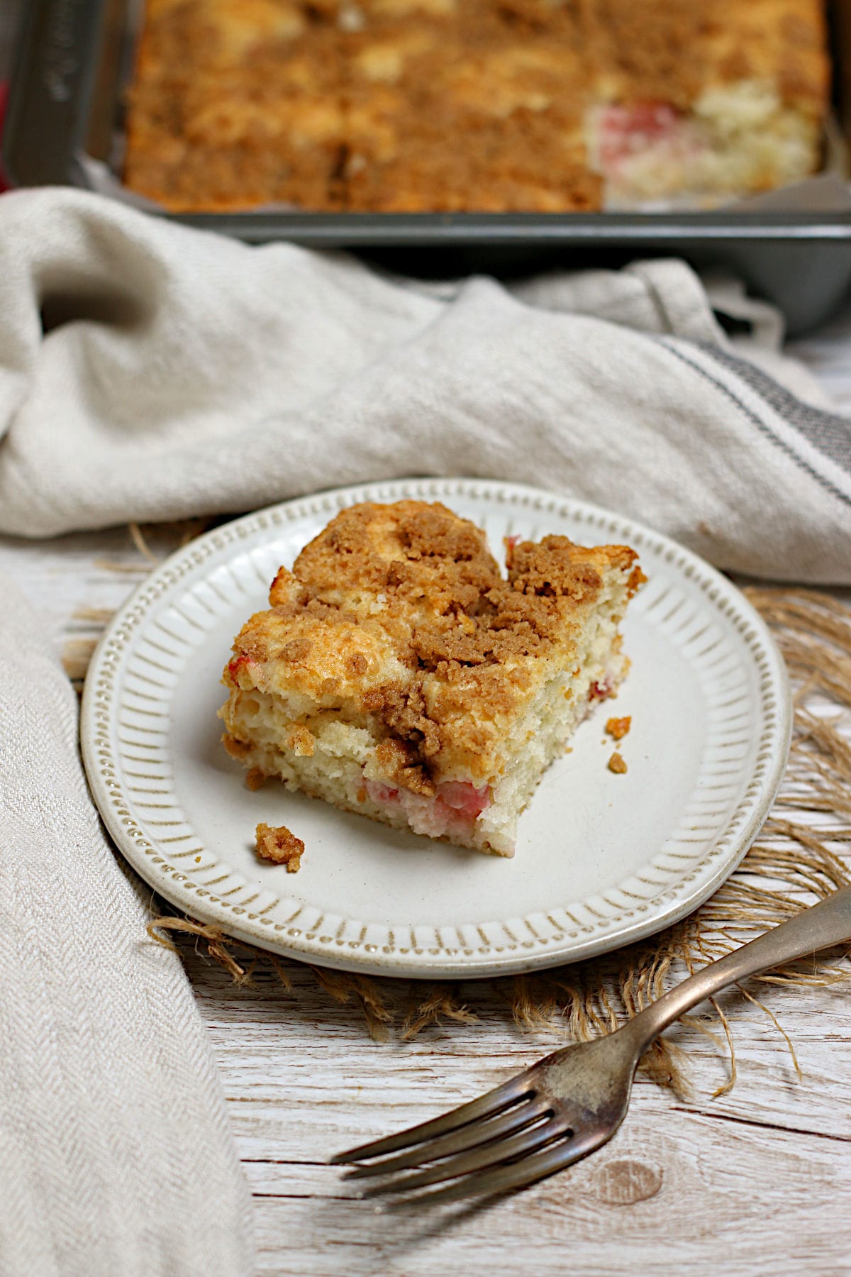 Greek Yogurt Rhubarb Coffee Cake on a small white plate.