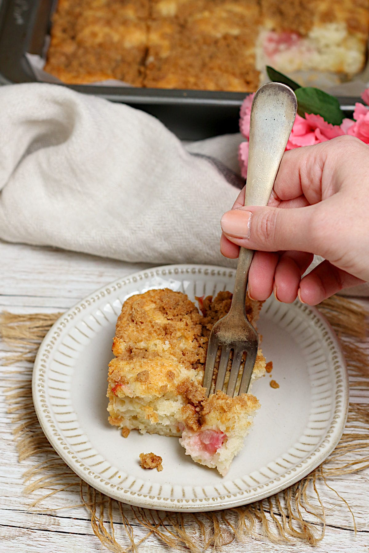 Greek Yogurt Rhubarb Coffee Cake on a small white plate.