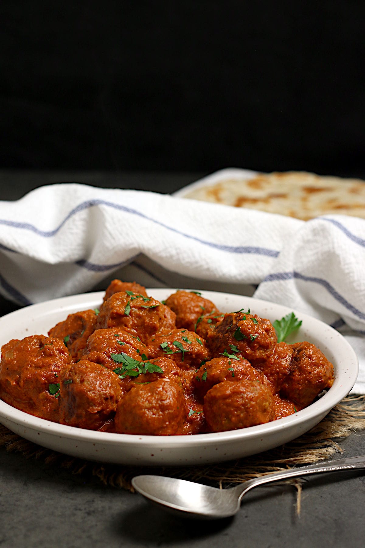 Butter Chicken Meatballs on a white plate.