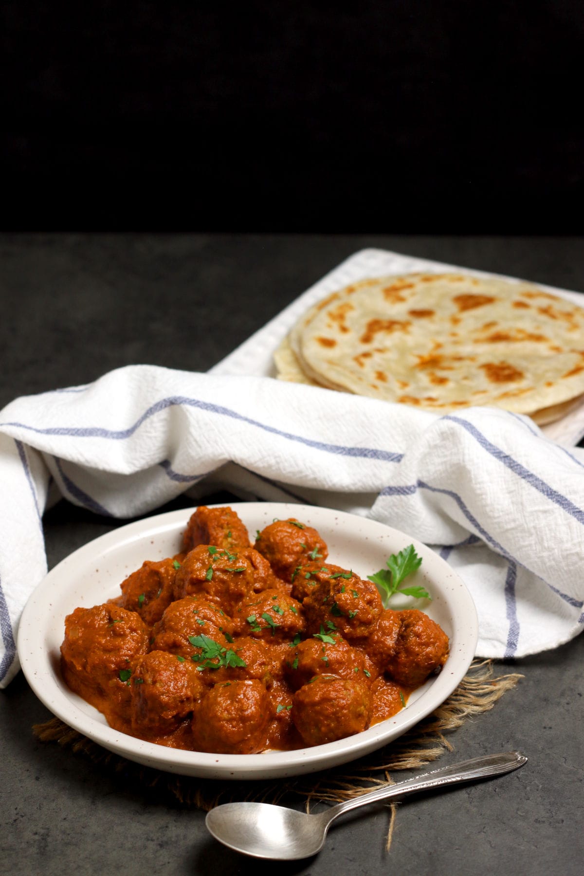 Butter Chicken Meatballs on a white plate.