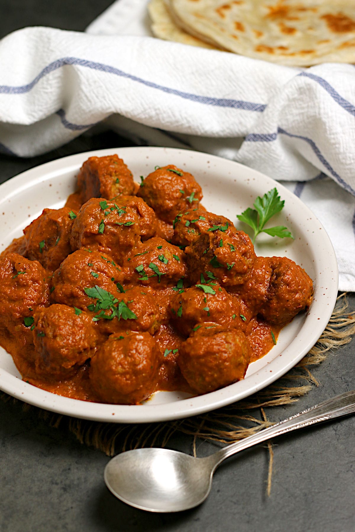 Butter Chicken Meatballs on a white plate.