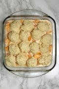 Peaches and Cream Cobbler in a glass baking dish before baking.
