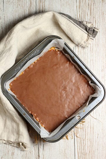 An overhead photo of an 8x8" pan of Chocolate Peanut Butter Crunch Bars.