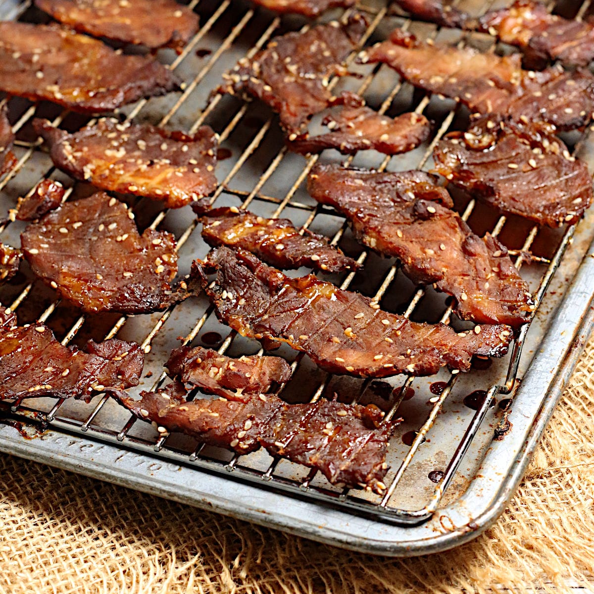 Domestic Dreamboat: Real, Easy, Food. Korean BBQ Pork Jerky on a baking sheet.
