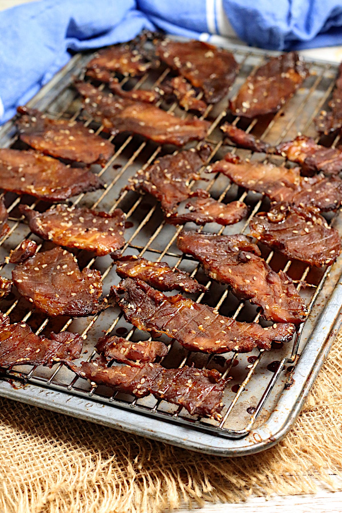 Korean BBQ Pork Jerky Korean BBQ Pork Jerky on a baking sheet.
