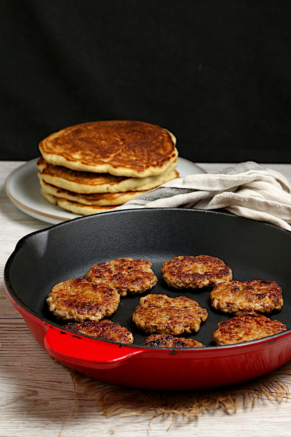 Homemade Breakfast Sausage Patties in a cast iron skillet.
